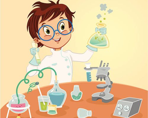 A young boy working on a chemistry experiment.